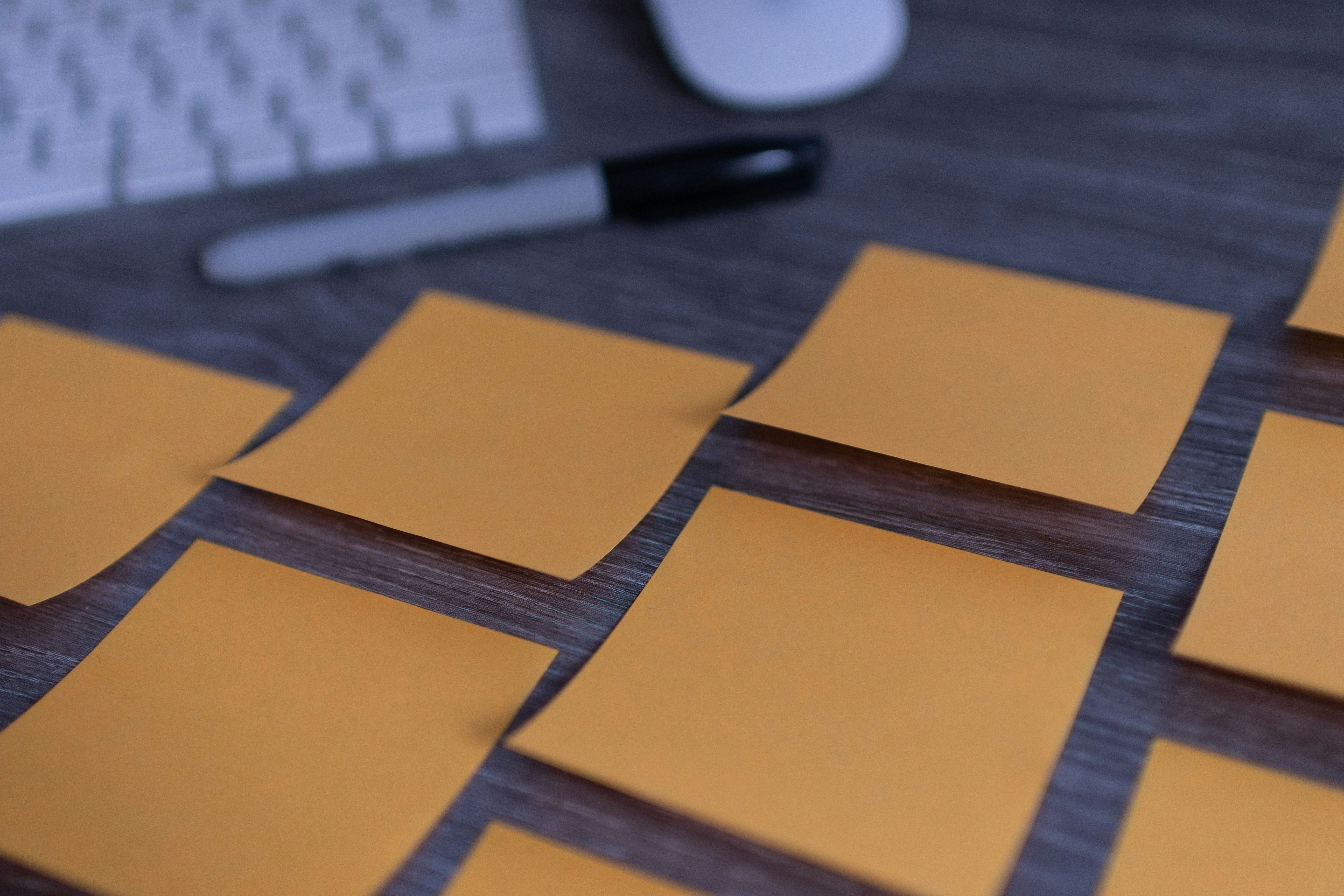 Sticky notes on a monitor representing visual task management